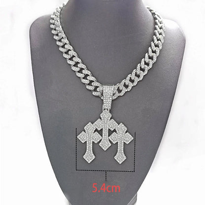 COLGANTE CRUZ TRIPLE BRILLANTE CON DIAMANTES